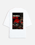 White t-shirt with a graphic of a motorcycle and text 'Two Wheels. One Tribe.' on a white background