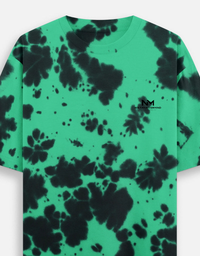 Green t-shirt with black tie-dye pattern and 'Maison' branding on a white background