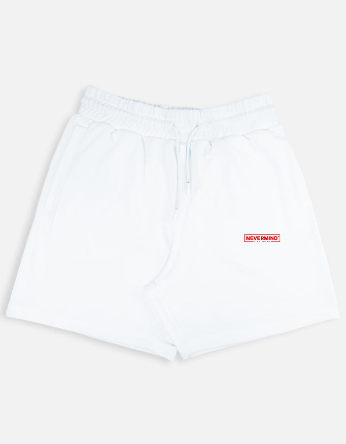 White shorts with a red 'NEVERMIND' label on a light gray background