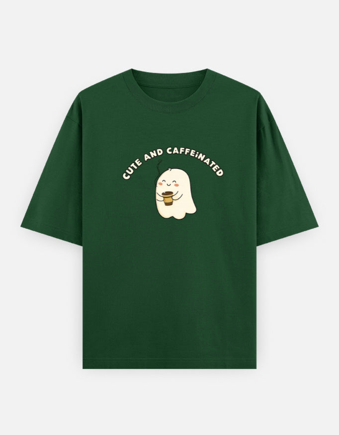Green t-shirt with a ghost graphic and text 'Cute and Caffeinated' on a white background
