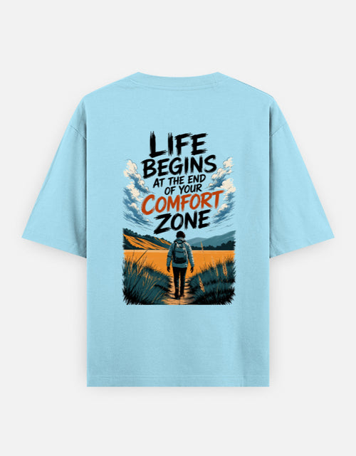 Light blue t-shirt with motivational quote and graphic on a plain background